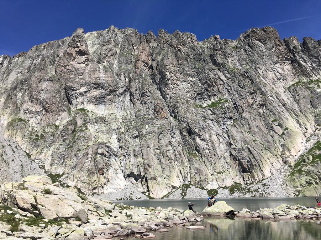The majestic south face of Cima d'Asta as seen from the lake below, near the Ottone Brentari mountain hut.