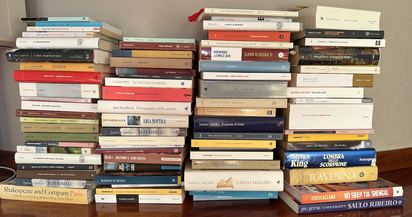 The pile of recently read books, all waiting patiently for a spot on the shelves.